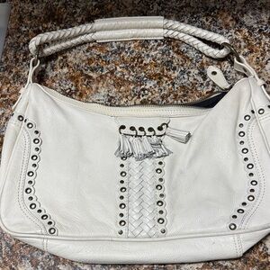 Wilson leather bag with gold hardware and rivets